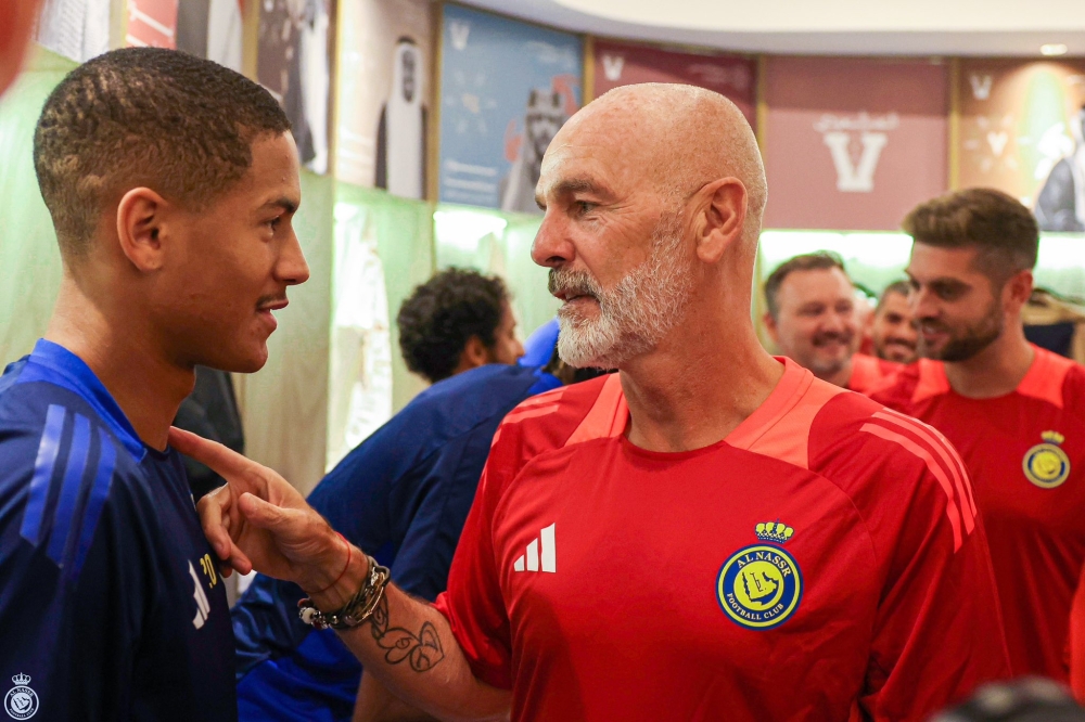 Stefano Pioli (right) greets Al Nassr players after being appointed as its new coach. — Picture from X/Al Nassr