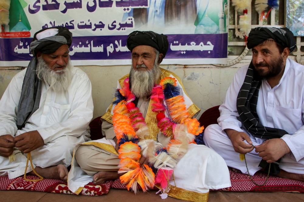 Haji Daad Muhammad, father of Saayd Muhammad Sarhadi, a police officer who opened fire and killed a man in custody on blasphemy allegations at a police station, sits with guests at his residence in Quetta, Pakistan September 18, 2024. — Reuters pic