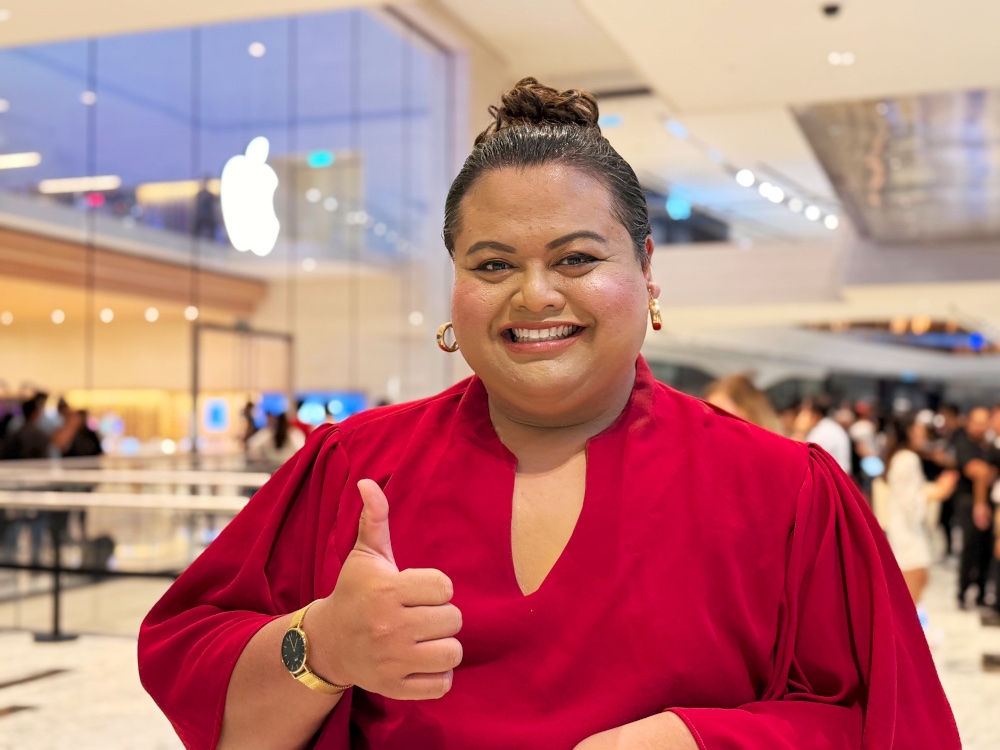 Reymey of Kuala Lumpur was just here with a friend but found the atmosphere at the first Apple Store iPhone Day exciting. — Picture by Erna Mahyuni