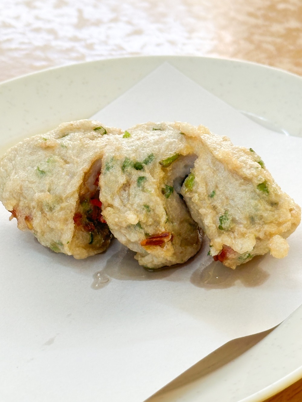 Tubular fish cake is enhanced with coriander and chopped chillies for more flavour and spiciness. — Picture by Lee Khang Yi