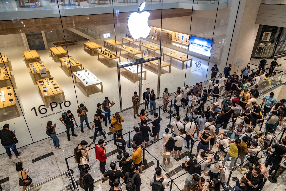 People line up to buy the newly launched iPhone 16  at an Apple store at the Tun Razak Exchange (TRX) in Kuala Lumpur September 20, 2024. — Picture by Firdaus Latif