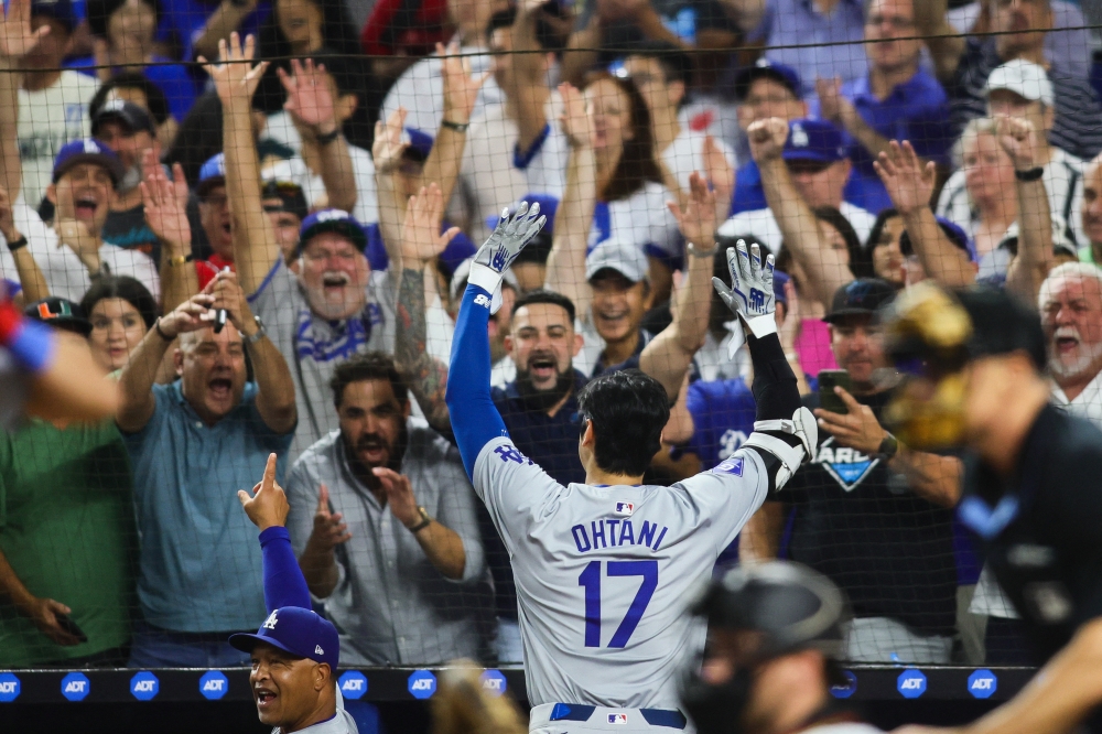 Los Angeles Dodgers designated hitter Shohei Ohtani reacts to a standing ovation from the fans after hitting his 50th home run of the season against the Miami Marlins during the seventh inning at loanDepot Park. — Reuters pic