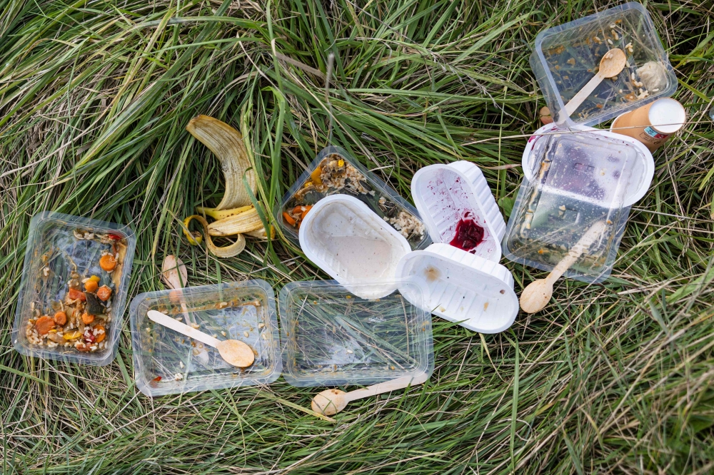 This photograph shows plastic containers of leftover meals at a migrants' makeshift camp in Mardyck, northern France September 16, 2024. In June 2022, Prime Minister Justin Trudeau’s federal government banned six types of single-use plastics with the goal of achieving zero plastic waste by 2030. — AFP pic