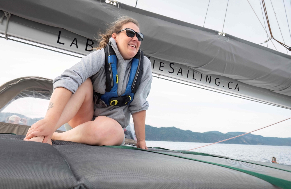 Anne-Marie Asselin, biologist and expedition leader of the Blue Organization, sitting on the Catamaran during the Blue Expedition, in Petit-Saguenay, Quebec July 24, 2024. — AFP pic