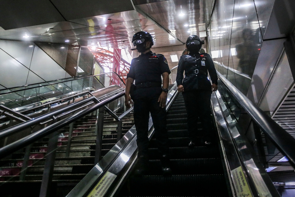 A general picture of the KTMB auxiliary police wearing the temperature scanner helmets for patrol its station and trains during the CMCO in KL Sentral. KTM (Keretapi Tanah Melayu) is turning to technology to help curb the spread of COVID-19 October 14, 2020.  Picture by Hari Anggara.