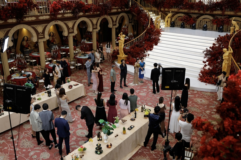 Actors practising on the set of a micro movie during a filming session at a banquet hall. — Reuters