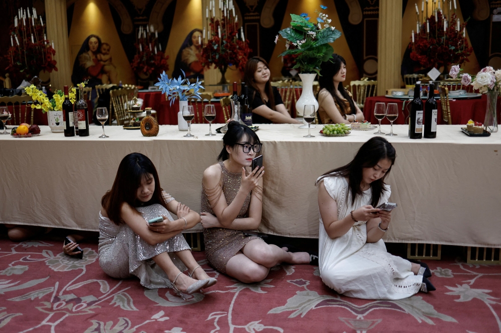 The cast wait on the set of a micro movie during a filming session.  — Reuters