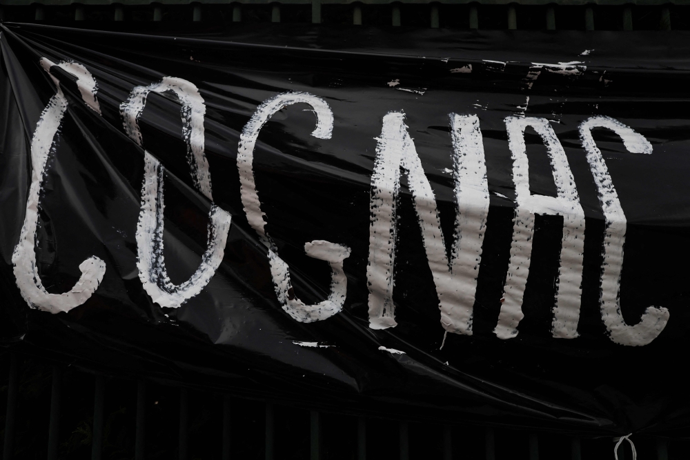 A black banner with the word Cognac is hung on a gate during a demonstration of winegrowers demonstrating against Chinese tax threats, in Cognac September 17, 2024. This protest, the first since 1998, comes after Beijing refused to rule out future tariffs following an anti-dumping investigation into brandy imported from the European Union. — AFP pic