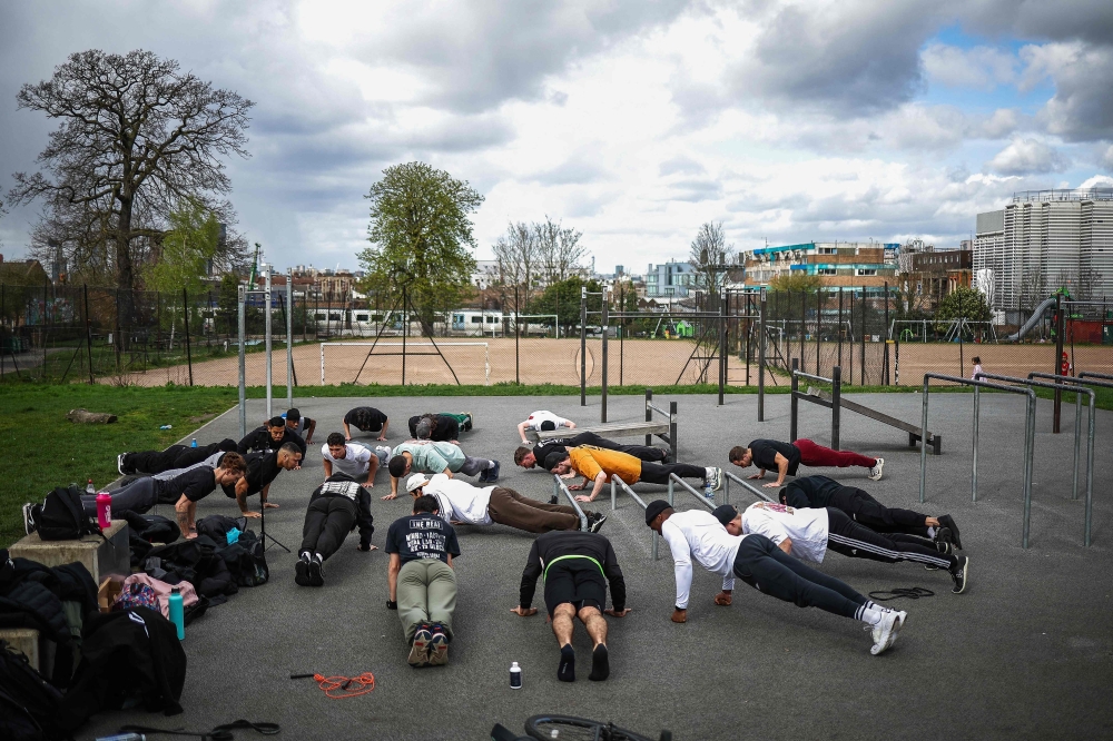 People attend a ‘Skills calisthenics’ training session at the calisthenics gym created by British anti knife crime charity Steel Warriors by melting the knife blades handed over by the Metropolitan Police, at Ruskin Park, in London March 23, 2024. The gym at a park near Brixton, south London, is one of four in the British capital constructed by the ‘Steel Warriors’ charity, which Wintour and co-founder Pia Fontes established in 2017 to help young people avoid knife crime. — AFP pic