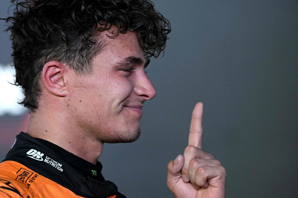 McLaren's British driver Lando Norris celebrates after winning the Formula One Singapore Grand Prix night race at the Marina Bay Street Circuit in Singapore September 22, 2024. — AFP pic