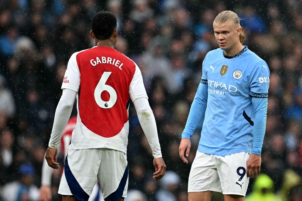 Manchester City's Norwegian striker #09 Erling Haaland looks at Arsenal's Brazilian defender #06 Gabriel Magalhaes during the English Premier League football match between Manchester City and Arsenal at the Etihad Stadium in Manchester September 22, 2024. — AFP pic