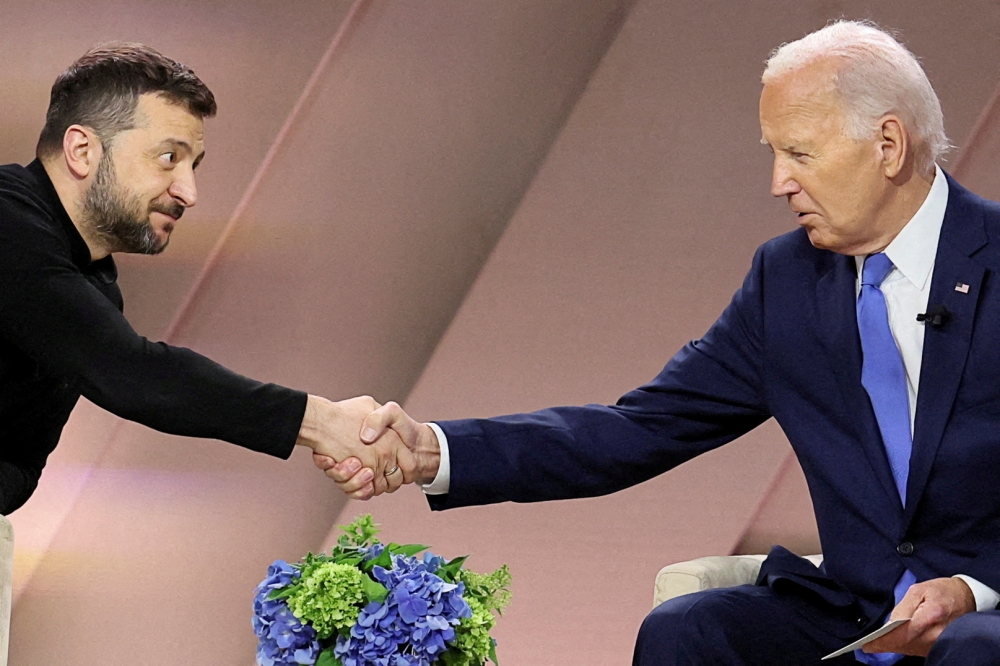 US President Joe Biden and Ukraine’s President Volodymyr Zelenskiy shake hands during a bilateral meeting, during Nato’s 75th anniversary summit, in Washington July 11, 2024. — Reuters pic