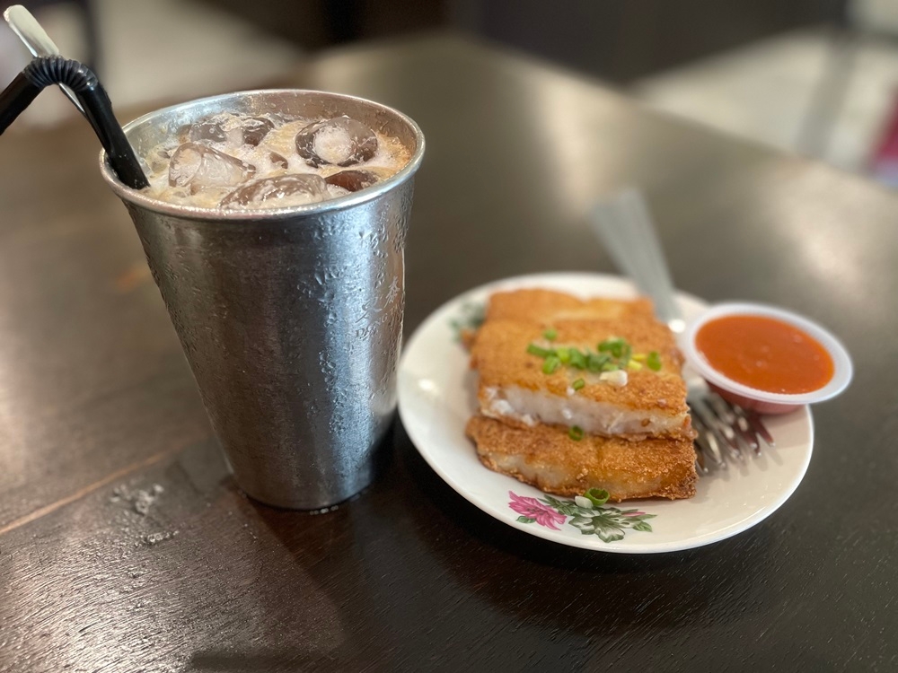 The iced white coffee and the pan-fried radish cake is popular among customers at the Dong Tai Kopitiam Pasir Pinji. — Picture by John Bunyan