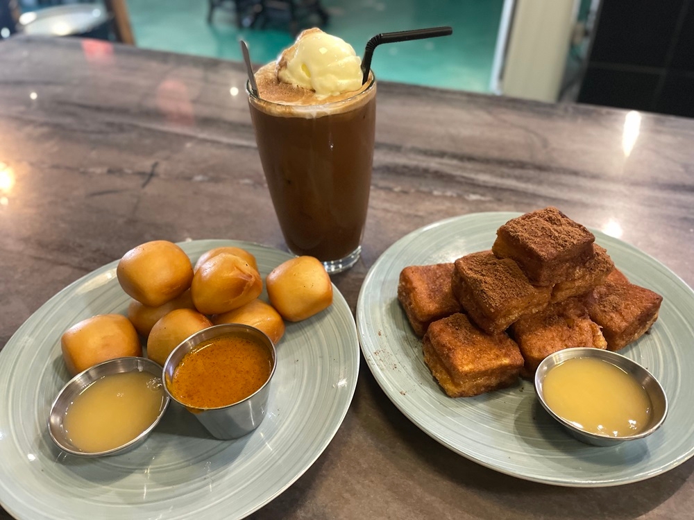 Classic Mealody Kopitiam Restaurant serves their white coffee with vanilla ice cream, while their French toast and golden mantou buns are popular among customers. — Picture by John Bunyan