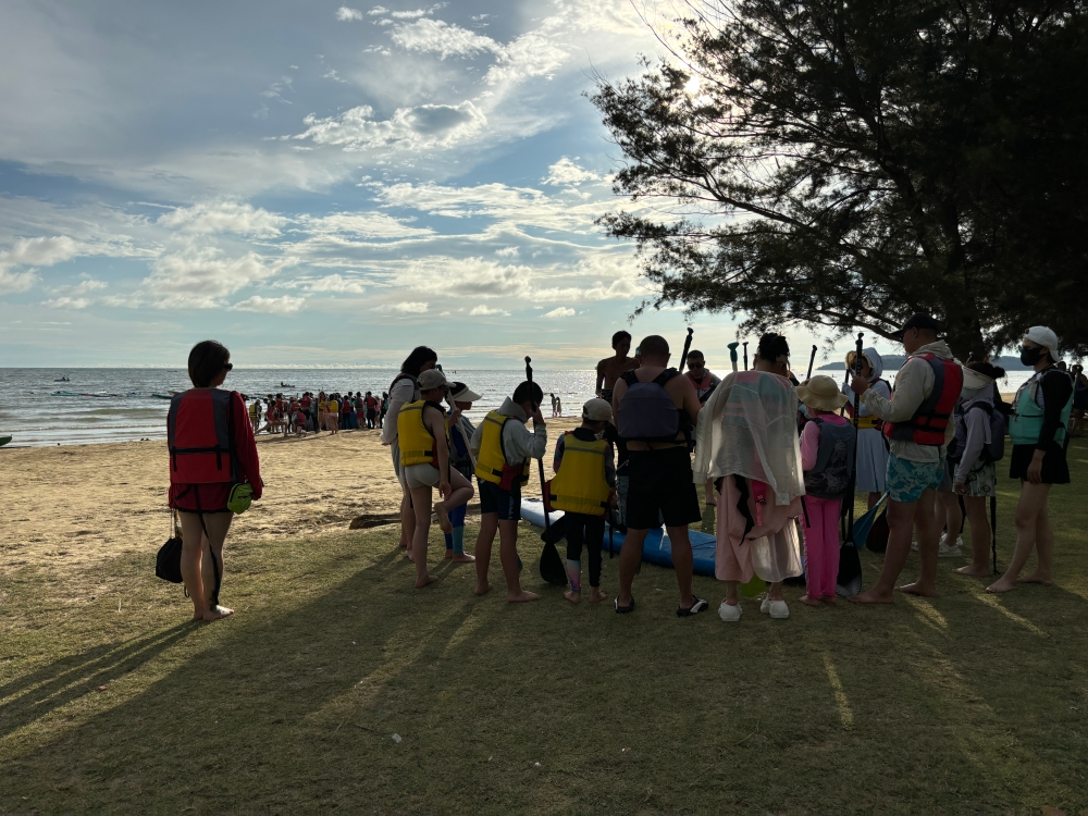 Tanjung Aru beach has become a huge tourist attraction but at the expense of the locals who now struggle with traffic. — Picture by Julia Chan