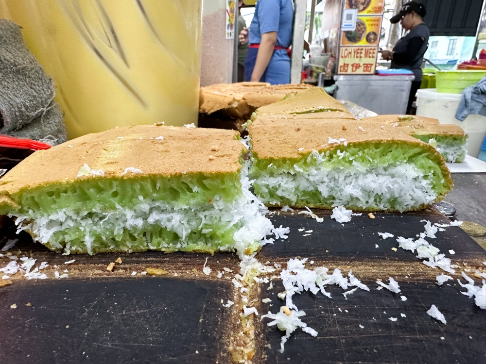 The pandan flavour 'apam balik' has a soft, squishy texture which pairs well with the grated coconut.  — Picture by Lee Khang Yi