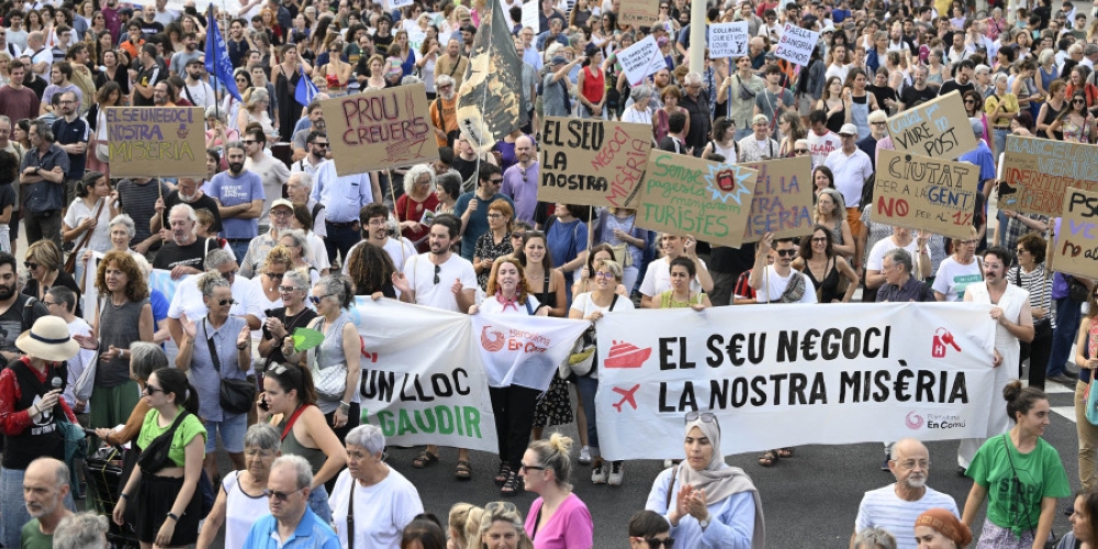 Thousands of people demonstrated in the streets of the Catalan capital, holding up signs with anti-tourism slogans. — AFP pic