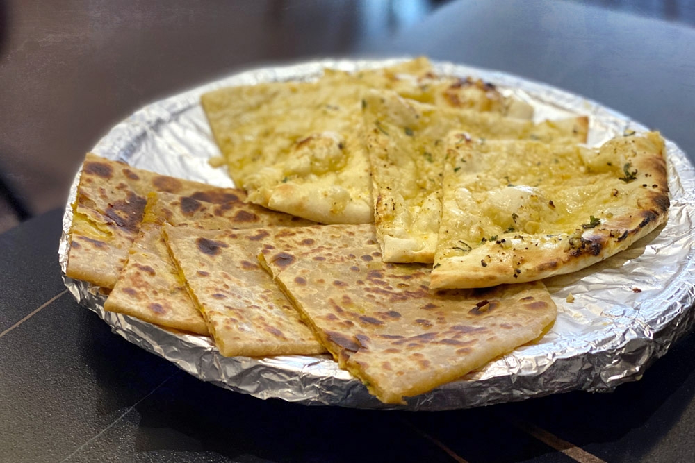 Aloo Perontha (left) and Garlic Naan (right). — Picture by CK Lim