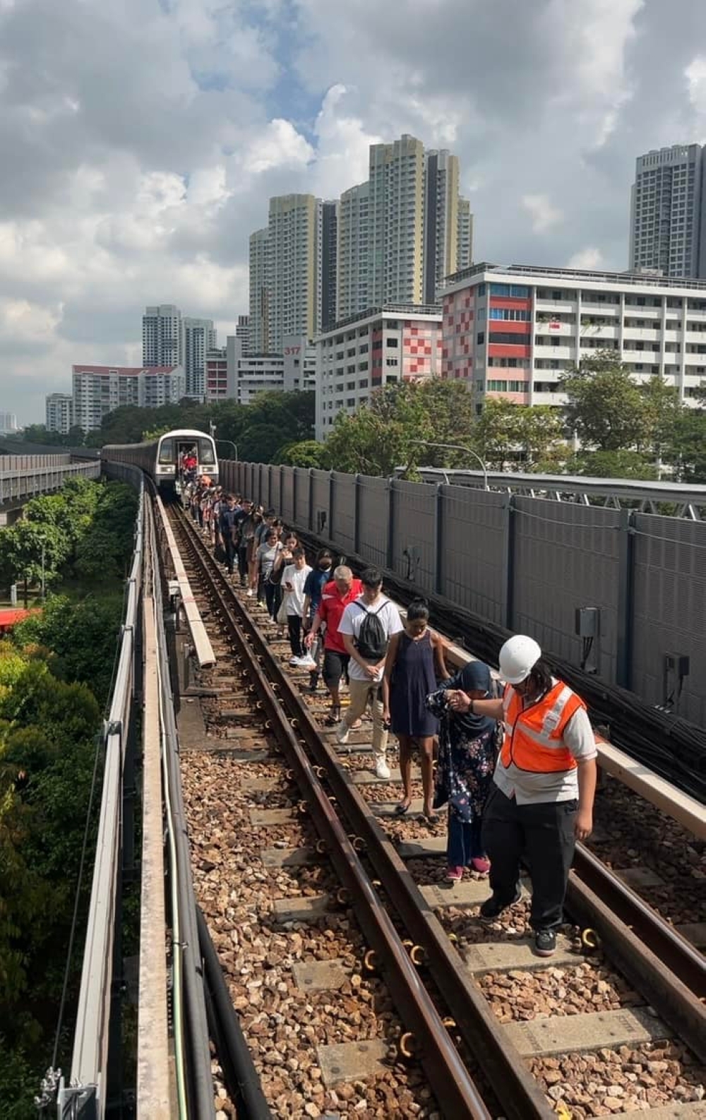 One train that stalled near Clementi station had approximately 850 passengers on board, who had to exit onto the tracks and were escorted back to the platform. — Picture via Facebook/SMRT