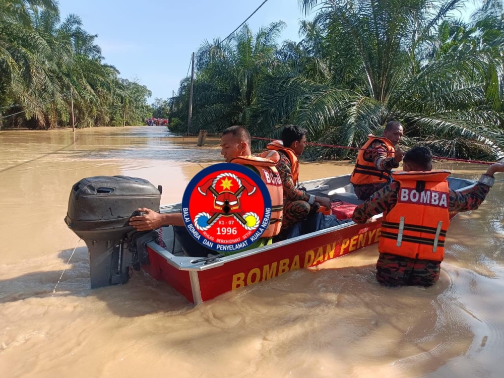 Rescuers from three fire stations have been deployed to search for Salmah Mat Zain, 46, and her 19-year-old disabled son, Muhammad Rosman Rohaidi who were reported missing at 8.29am while braving flash floods in Kampung Tanjung Kiri, near Kuala Nerang, Kedah September 28, 2024. — Picture from Facebook/Bomba Kuala Nerang