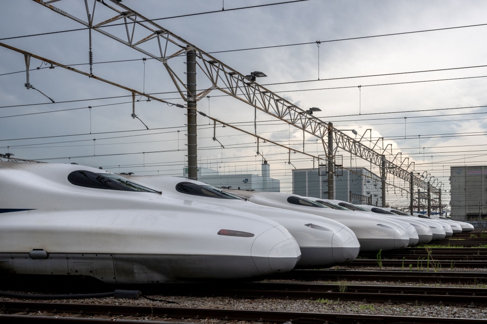 The N700A and N700S series trains are parked at the JR Central's Shinkansen depot in the Shinagawa district of Tokyo July 24, 2024. — AFP pic