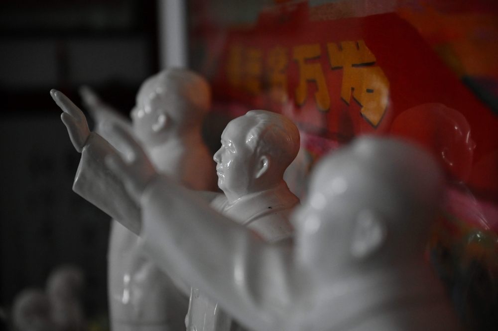 Statues of late Chinese communist leader Mao Zedong are seen in the living room of former soldier and Mao memorabilia collector Feng Gang in Baotou September 7, 2024. — AFP pic