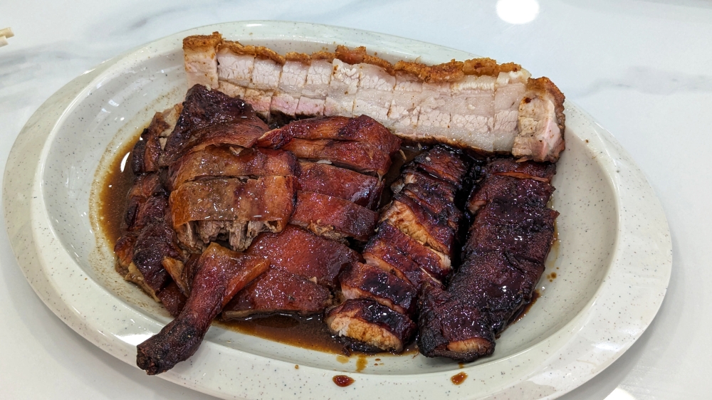 The mixed three platter of roasted meats, including a surprisingly good 'char siu'. — Picture by Ethan Lau