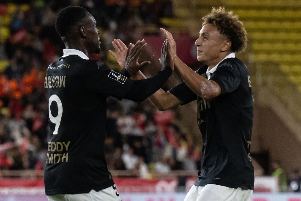 Monaco’s Folarin Balogun celebrates with his teammate Eliesse Ben Seghir after scoring the team’s first goal during their Ligue 1 match against Montpellier in Monaco September 28, 2024. — AFP pic