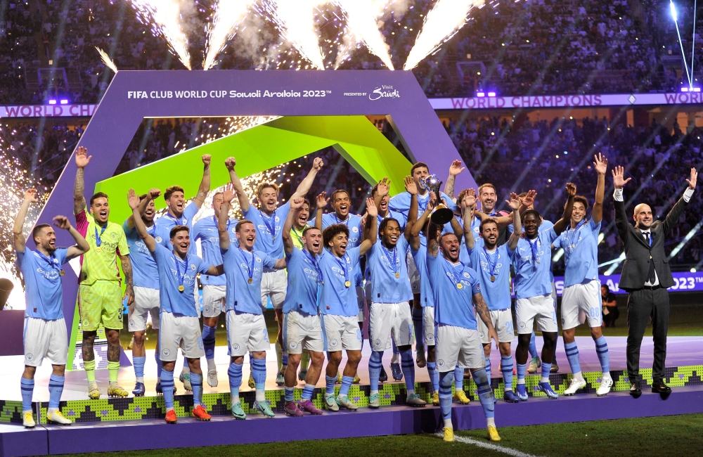 Manchester City’s Kyle Walker lifts the trophy alongside teammates after winning the Club World Cup final in Jeddah December 23, 2023. ― Reuters pic