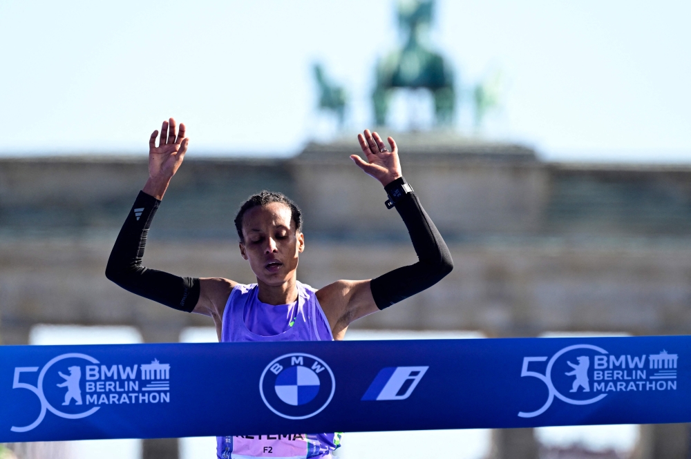 Tigist Ketema crosses the finish line to win the 50th edition of the Berlin Marathon in Berlin. — AFP pic