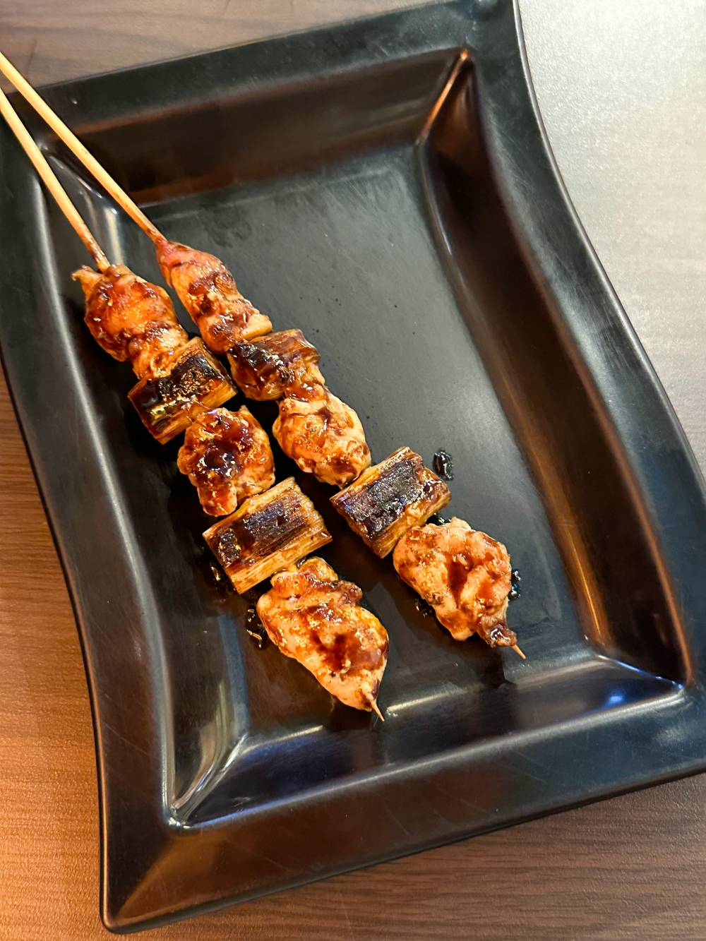 Some of the skewers like the chicken and leek ‘yakitori’ is brushed with ‘tare’ sauce. — Picture by Lee Khang Yi