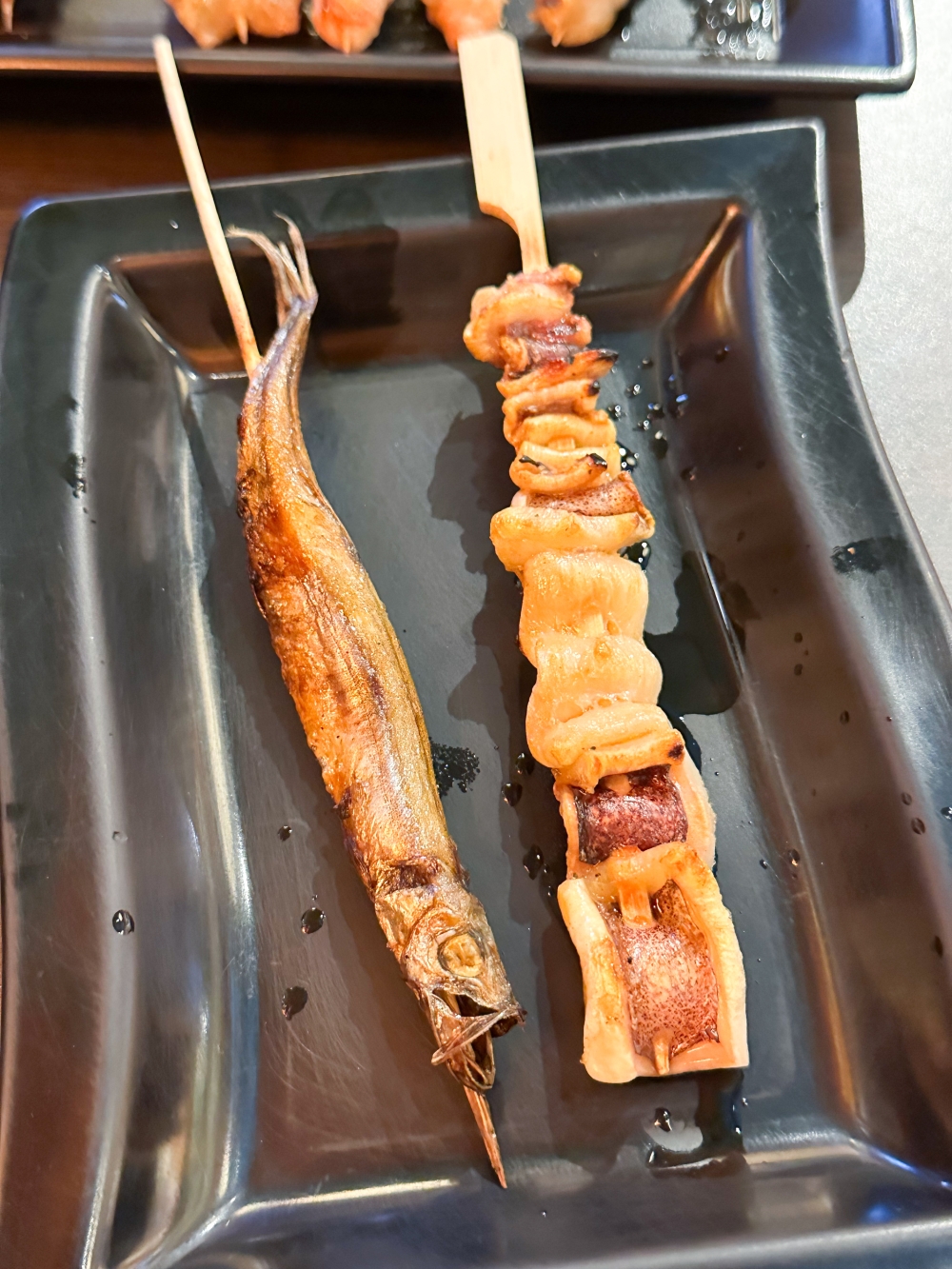 ‘Shishamo’ and a perfectly cooked squid ‘yakitori’ that isn’t rubbery. — Picture by Lee Khang Yi