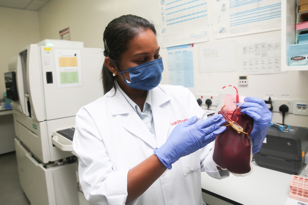 Pathmavathy Supramani, Senior Scientist, Medical Laboratory, SJMC, talks about the hospital's blood bank unit's critical support for the CABG procedure. — Image by Choo Choy May 