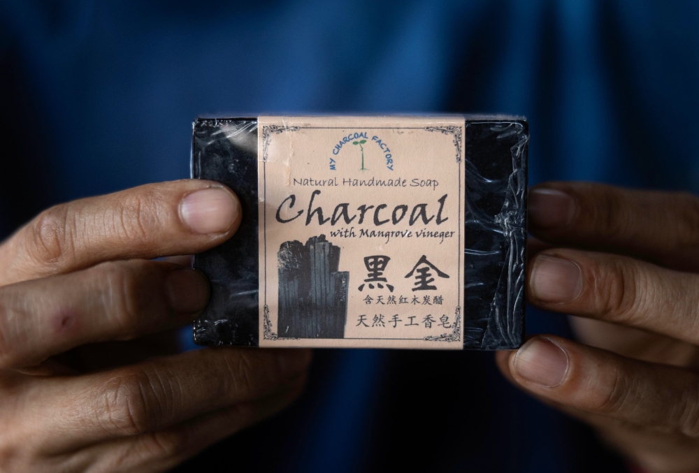 A bar of soap made from mangrove wood charcoal. — Bernama pic