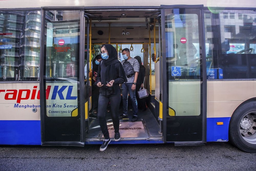 A file photograph shows passengers disembarking from a RapidKL bus at KLCC in Kuala Lumpur, on May 4, 2020. — Picture by Hari Anggara