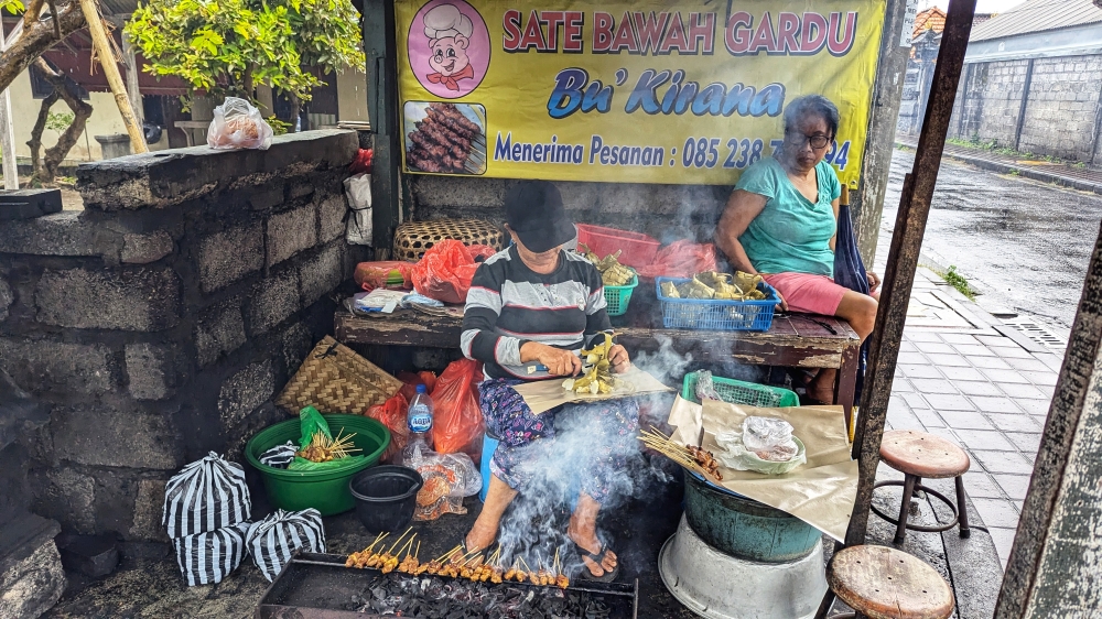 Blink and you’ll miss it: Ibu Kirana is set up in a shack on a street corner and sells out by noon or one in the afternoon most days. — Picture by Ethan Lau