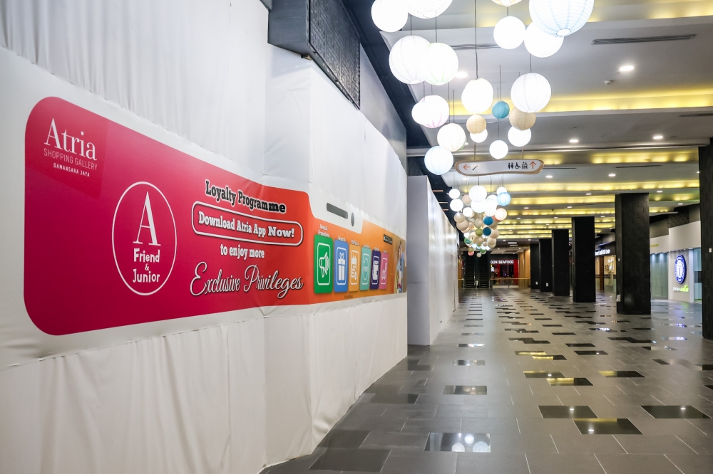 Hoarding boards are seen outside shop lots in the Atria Shopping Gallery in Petaling Jaya on October 3, 2024. — Picture by Firdaus Latif