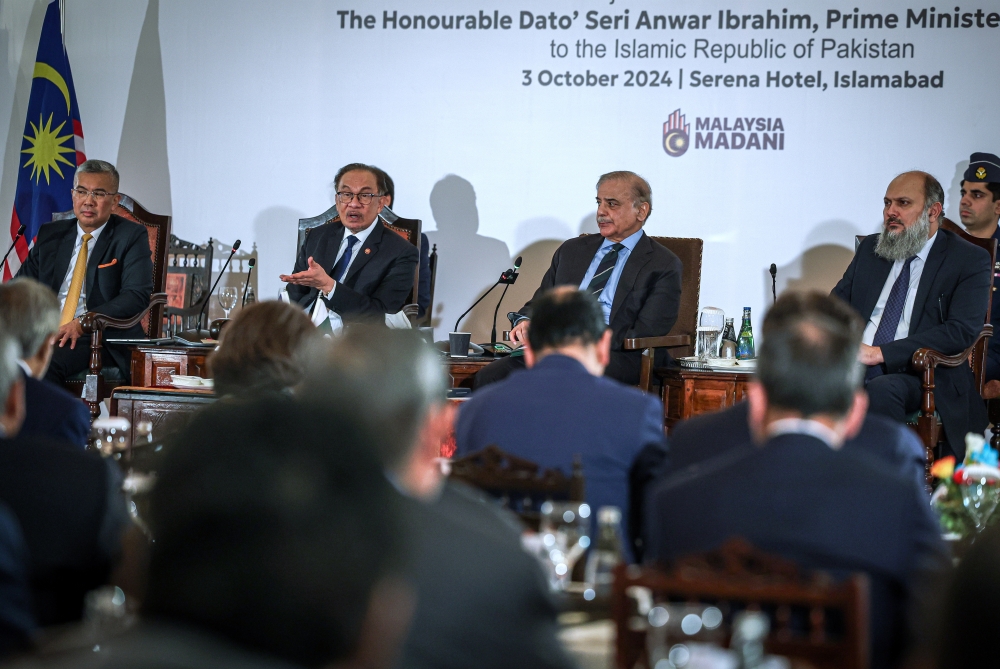 Prime Minister Datuk Seri Anwar Ibrahim (2nd left) with the Prime Minister of Pakistan, Shehbaz Sharif at the High Level Business Dialogue in conjunction with the state visit to Pakistan October 3, 2024. — Bernama pic