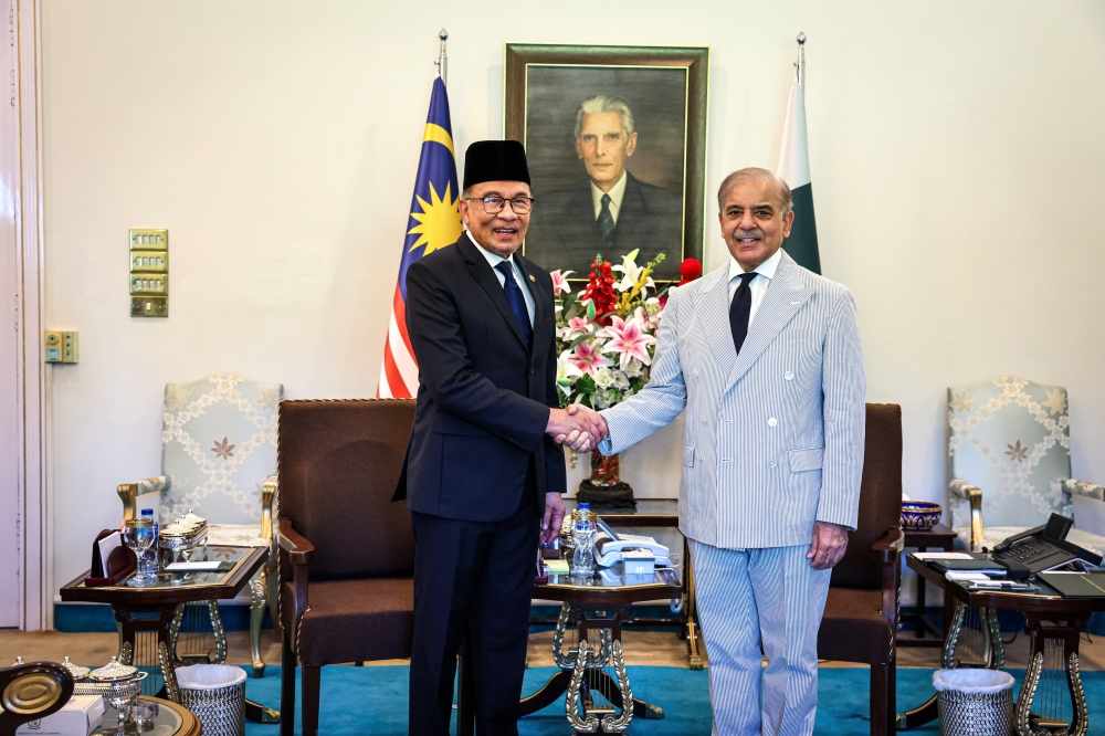 Prime Minister Datuk Seri Anwar Ibrahim (left) with his Pakistani counterpart, Shehbaz Sharif during a closed meeting on a state visit at the Official Residence of the Prime Minister of Pakistan in Islamabad October 3, 2024. — Bernama pic