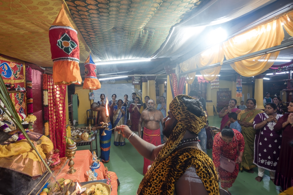 A Hindu priest performs a sacred ritual while devotees pray during the Navaratri festival at a temple in Semenyih, Selangor on October 3, 2024. — Picture By Raymond Manuel