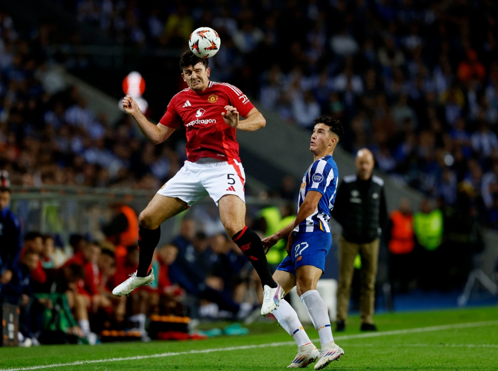 Manchester United’s Harry Maguire heads the ball during his team’s Europa League match against FC Porto at the Estadio do Dragao, Porto, Portugal on October 3, 2024. — Reuters pic