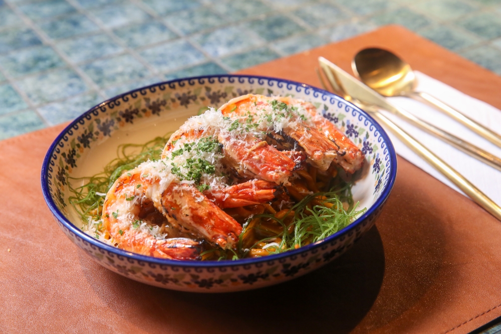 Fresh Chitarra Pasta is paired with Tiger Prawns and a rich crustacean sauce with pops of ikura — Picture by Choo Choy May