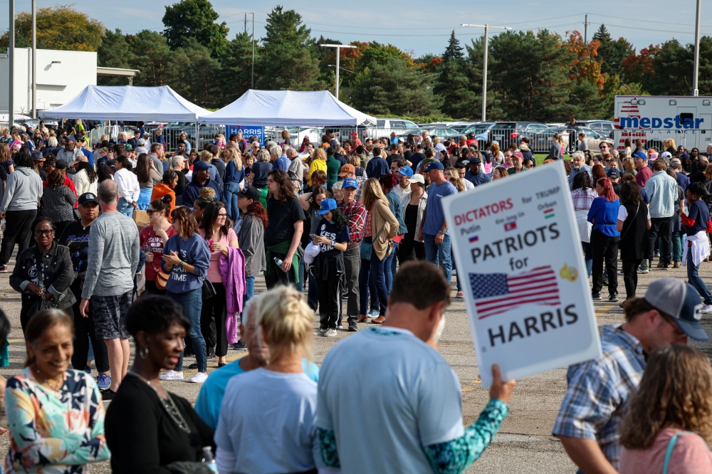 Supporters of Democratic presidential nominee and U.S. Vice President Kamala Harris wait in line to attend her campaign event, in Flint, Michigan, U.S., October 4, 2024.  — Reuters pic