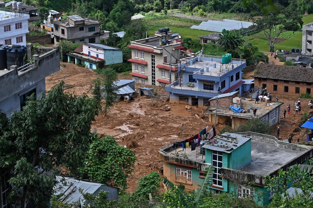 A general view of a landslide-affected village is pictured following heavy rains in Lalitpur district on the outskirts of Kathmandu October 1, 2024. — AFP pic