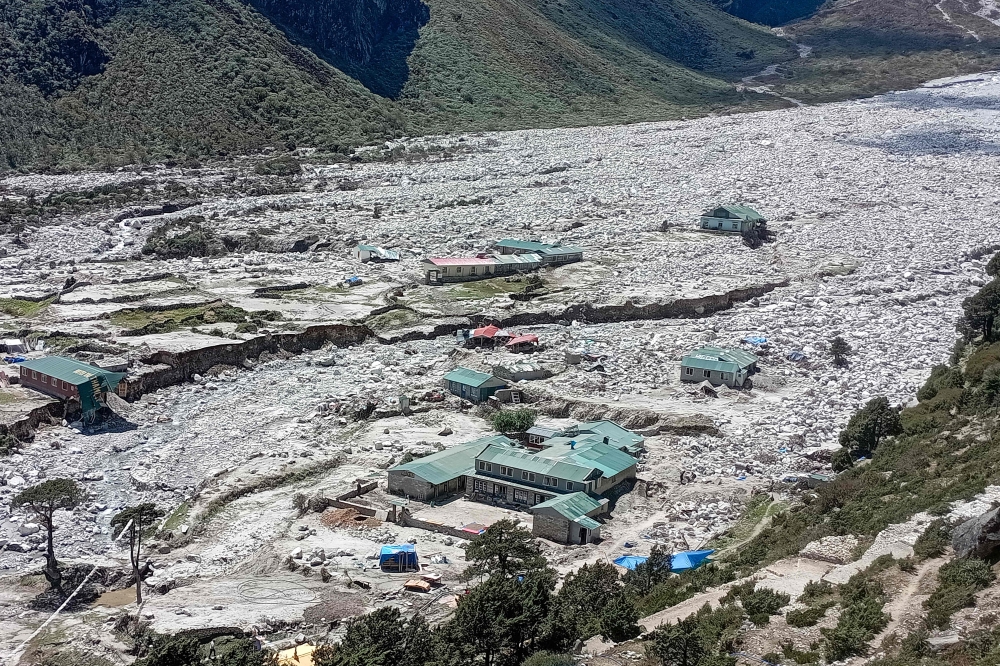 In this photograph taken on September 18, 2024, houses lie abandoned in the aftermath of flood caused by glacial lake outburst, at Thame village in Solukhumbu district. 