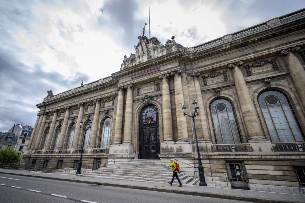 A man walks past the entrance of the Art and History Museum hosting the exhibition on protection of cultural property in case of conflict entitled ‘Heritage in Peril’ in Geneva October 3, 2024. — AFP pic