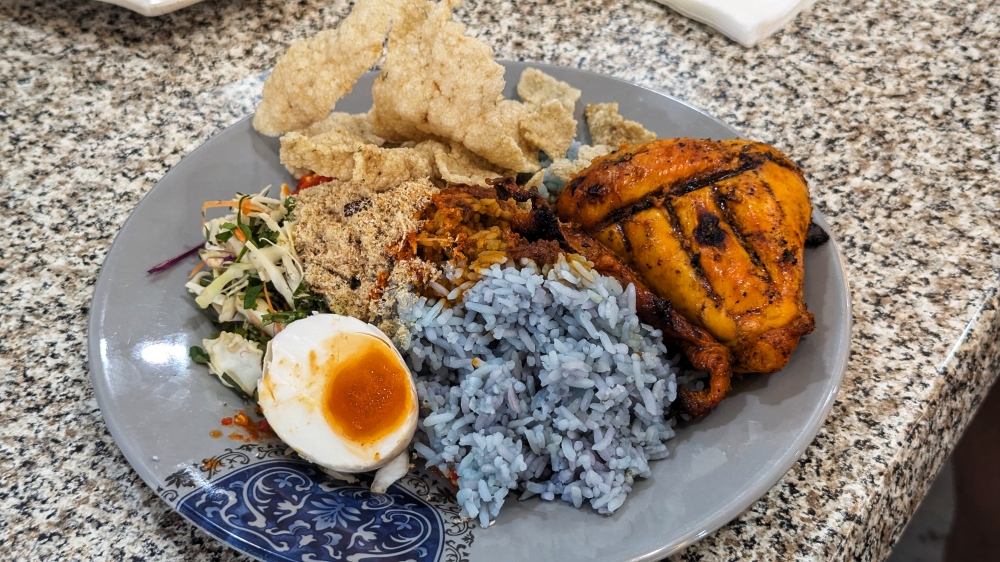 ‘Nasi kerabu' with ‘ayam bakar’. — Picture by Ethan Lau