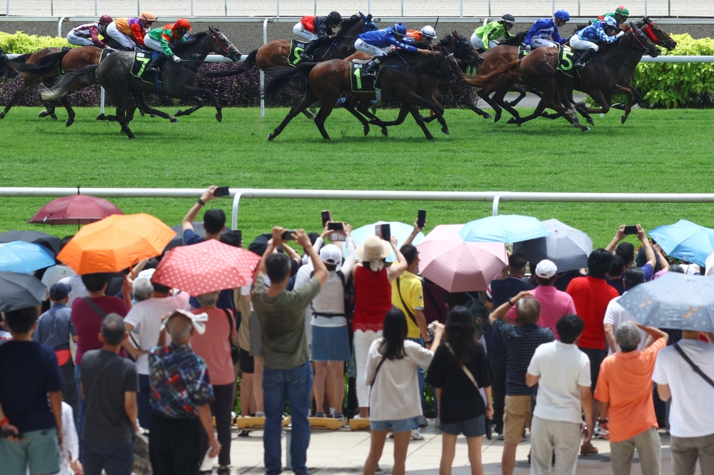 Horses race in the Grand Singapore Gold Cup on the last race day at the Singapore Turf Club, in Singapore October 5, 2024. — Reuters pic  