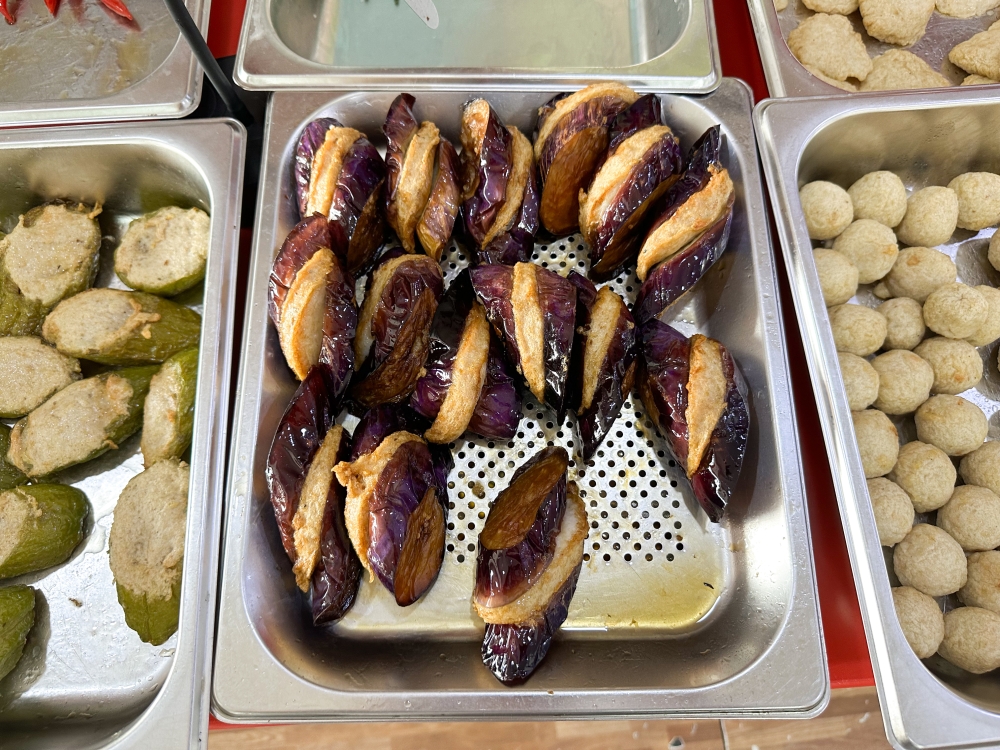 The stuffed items are fried in batches and placed at the counter. — Picture by Lee Khang Yi