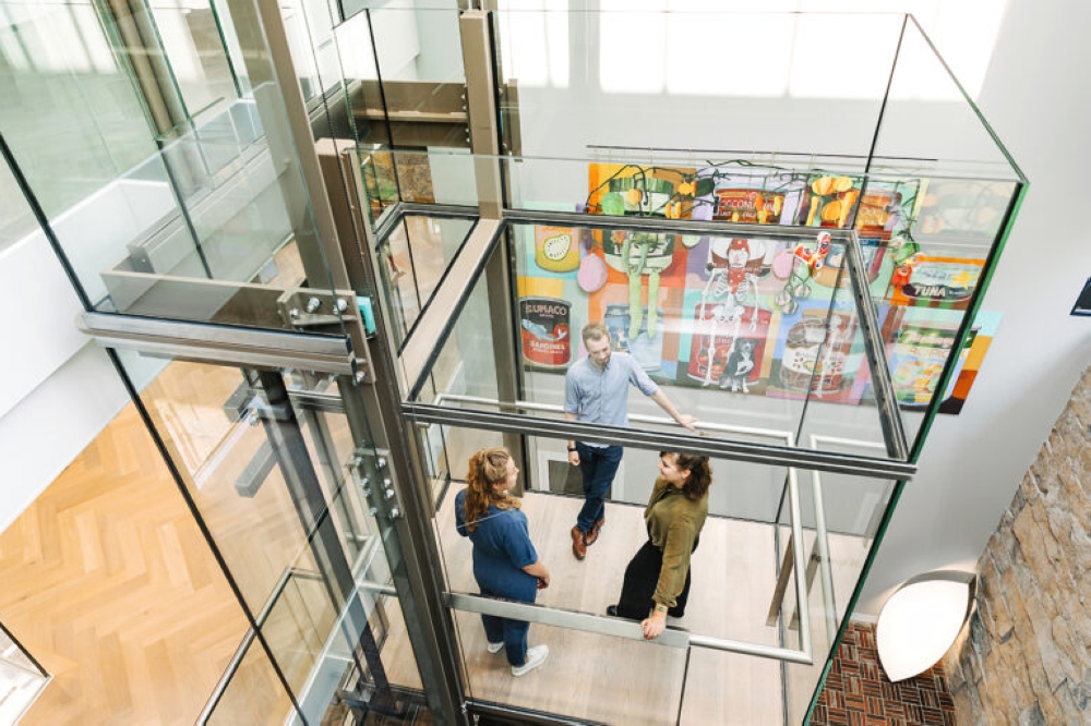 The LAM museum displayed the cans in the glass lift shaft as if they had been left behind during construction. — Picture from LAM